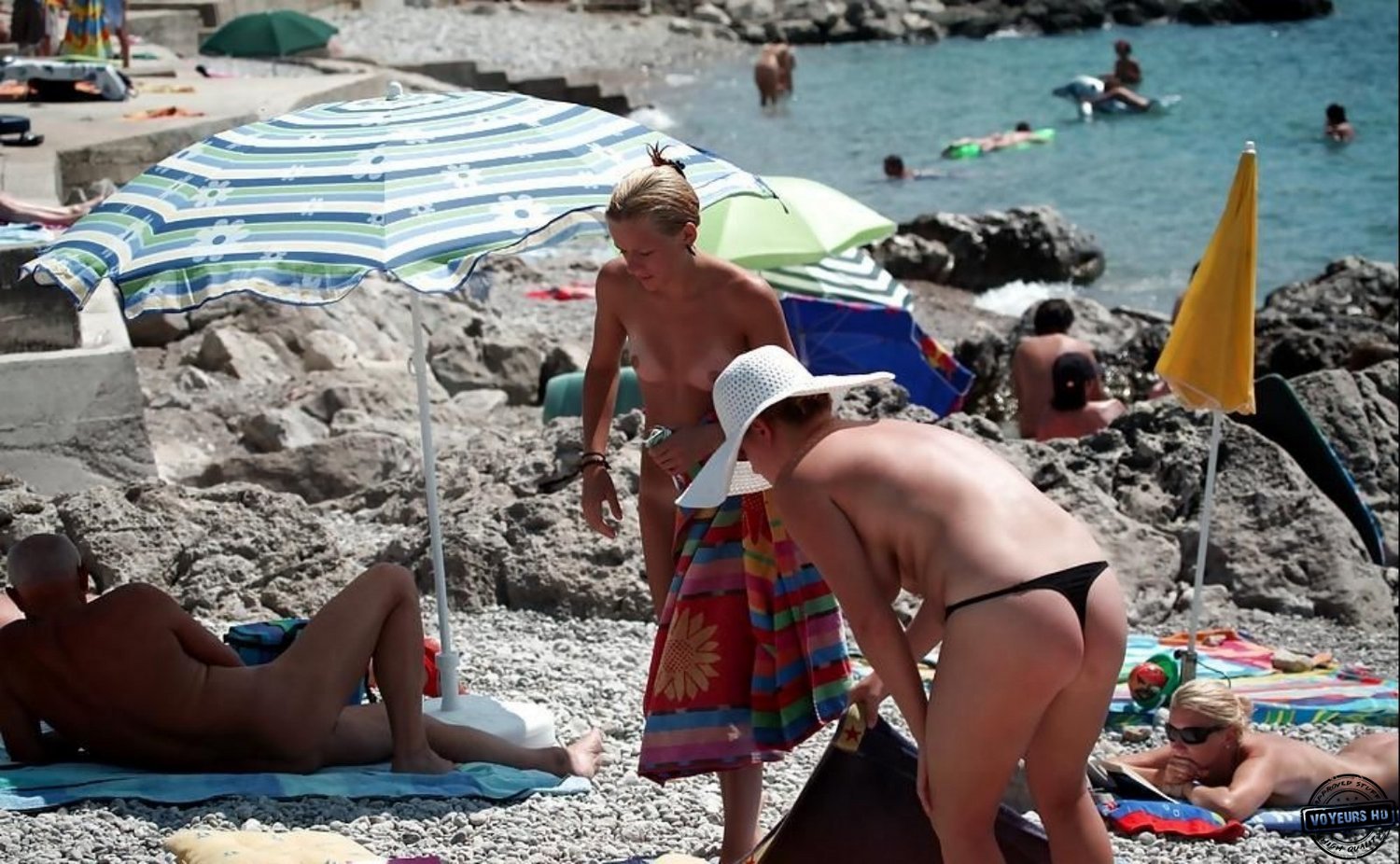 Mom and daughter nude on beach