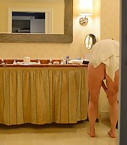 Unaware wife in hotel bathrooms