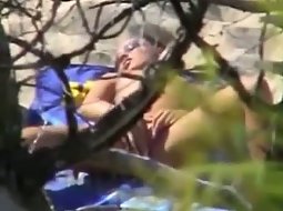 Girl masturbating on a secluded beach