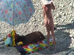 Nudist couple arrived to the beach