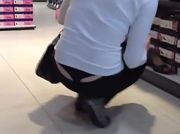 Thong of a girl picking shoes