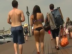 Girl in a thong bikini gets followed