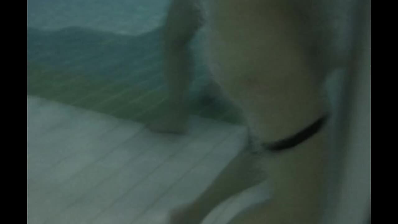 A woman alone, enjoying the pool jet for masturbation