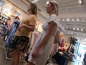 Upskirt of a lovely blonde in the clothes store