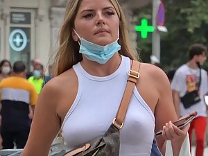 Two different girls with lots of makeup and no bras