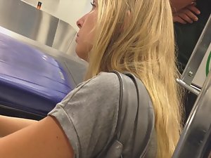 Pretty blonde waits for luggage