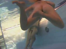 Nude swimmers from within the pool