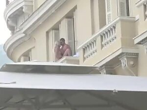 Wild fuck on hotel balcony in city center