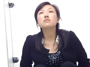 Spying on hairy pussy of an elegant asian girl in toilet