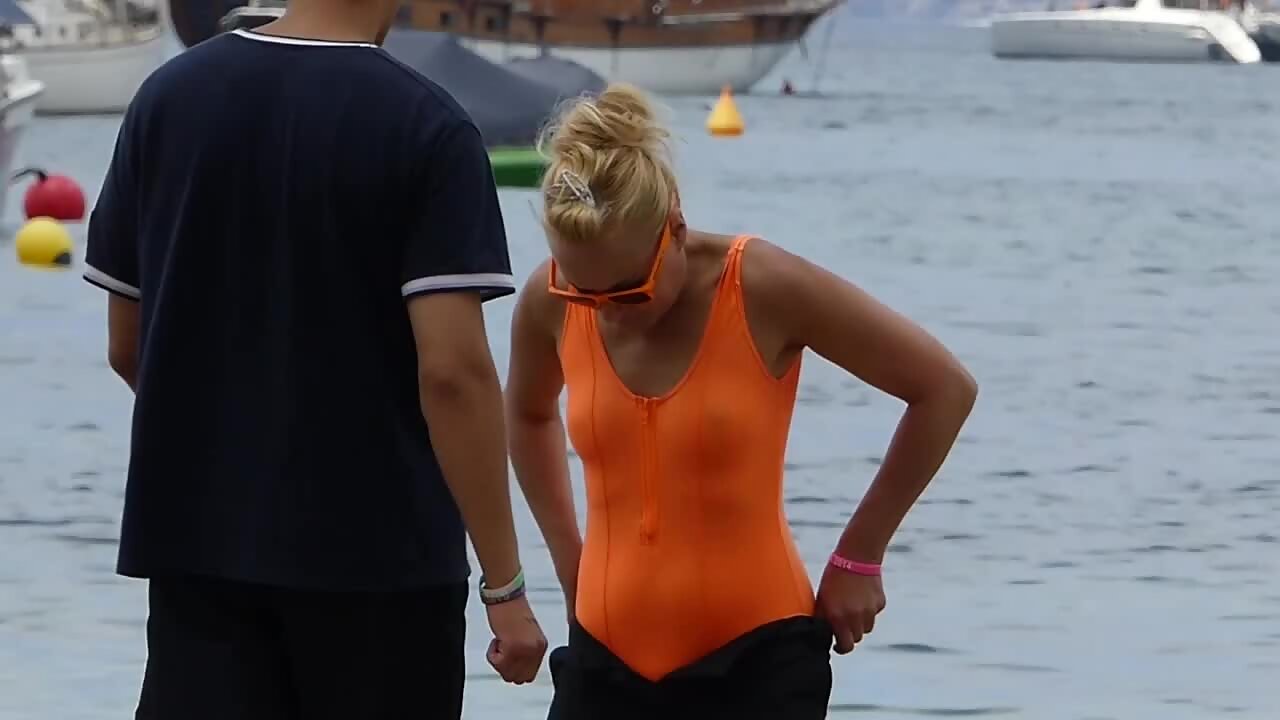 Nipples got visible through dry orange swimsuit - Voyeurs HD