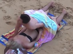 Trying to hide a beach fuck