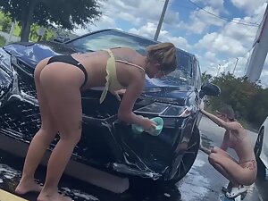 Inspection of girls washing cars in their bikinis