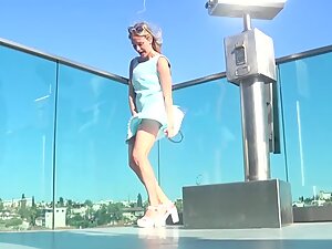 Upskirt of attractive tourist girl in the city