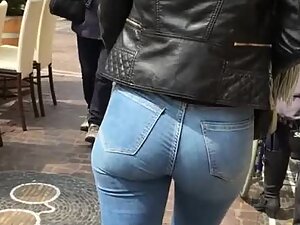Curly girl wiggles her tight ass cheeks in jeans