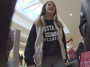 Happy teenage shopper in sexy tights