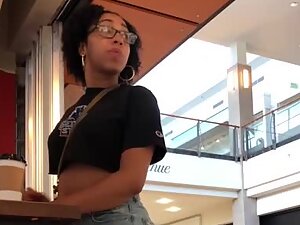 Nerdy black girl looks sexy in torn jeans