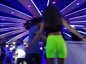 Epic ass in fluorescent shorts at a nightclub