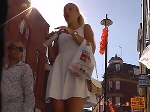 Upskirt shows a sexy tan line on her plump butt