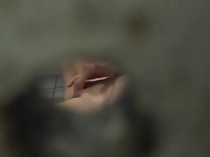 Pussy rubbing caught through peeping hole in pool cabin