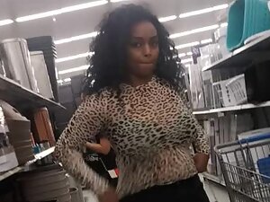 Black girl's big boobs visible through leopard blouse
