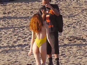 Sexy redhead poses on beach for her friendzoned black friend