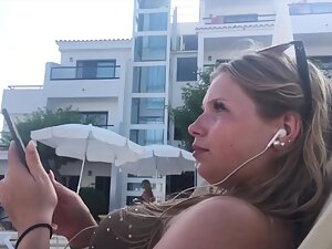 Pretty girl turns a guy into a voyeur by the swimming pool