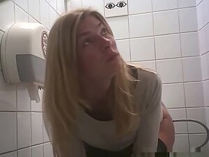 Spy on hot blonde's ass and pussy in public toilet