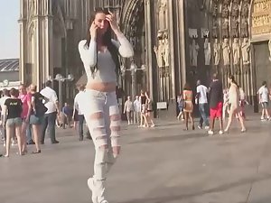 Sex appeal of teen girl in torn white jeans