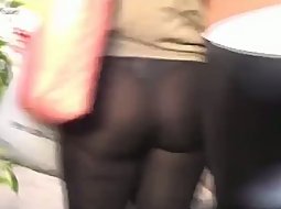 A teen girl in tight see through pants