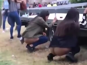 Candid camera caught two cute girls pissing in public