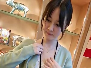 Asian store clerk got cute small tits down her blouse