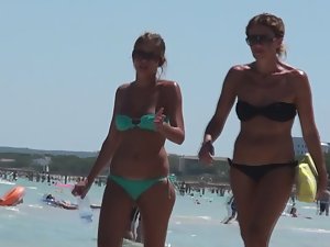 Mother and daughter together on beach
