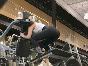 Fitness chick does squats for booty building