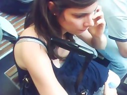 Tits of a girl on the train station