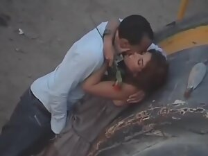 Kissing and pussy fingering caught by street voyeur