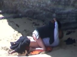 Couple banging on the beach