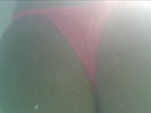 Underwater view of big butt and little pussy bulge