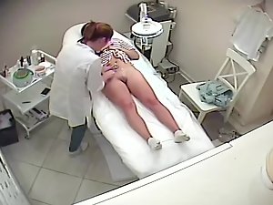 Pussy and anus wax job seen through hidden cam