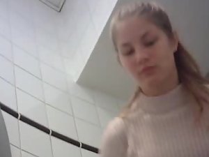 Cute girl's naked ass seen on hidden camera in toilet