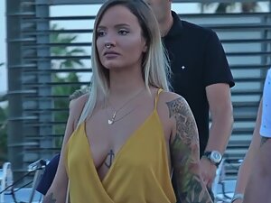 Hipster girl got an anchor tattoo between her boobs