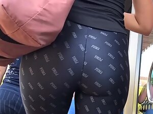 Tall girl wiggles her ass in interesting tights