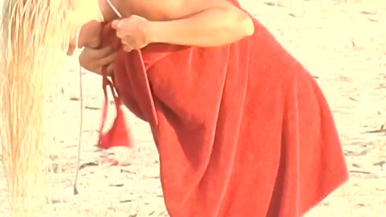 Accidental nudity of epic blonde changing bikini on beach