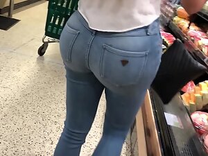 Like she got two watermelons in tight blue jeans