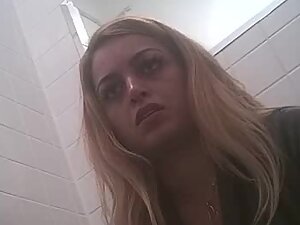 Spying on facial expressions of a pissing blonde
