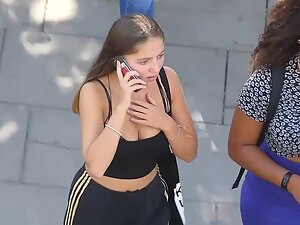 Checking her cleavage during shocking phone call