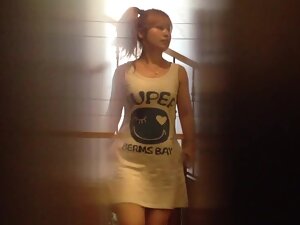 Voyeur peeps on hot asian girl from under toilet wall