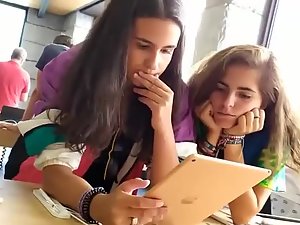 Lesbian girl touches her girlfriend's butt in public
