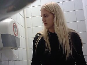 Spying on blonde that looks elegant even while peeing