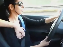 Girl drives and jerks him off