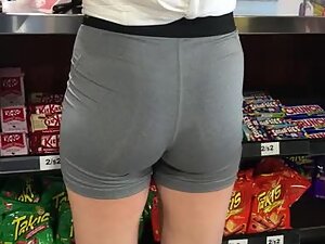 Small athletic ass in tight shorts spotted in a store